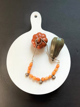 Load image into Gallery viewer, Quartzite orange nugget stone with vintage brass art
